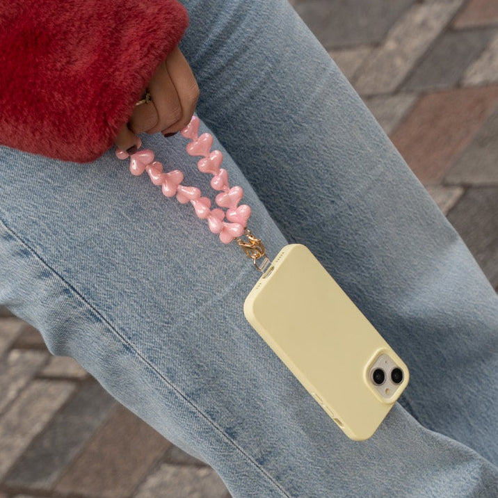 hartjes telefoonkoord en geel hoesje